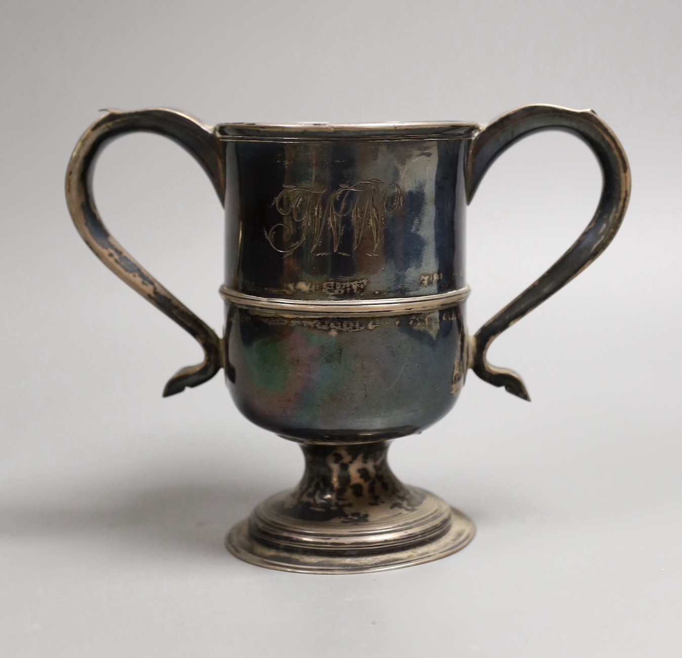 A George III provincial silver two handled pedestal cup by Dorothy Langlands, Newcastle, 1809, with later engraved initials and date, height 14.5cm, 11.9oz.